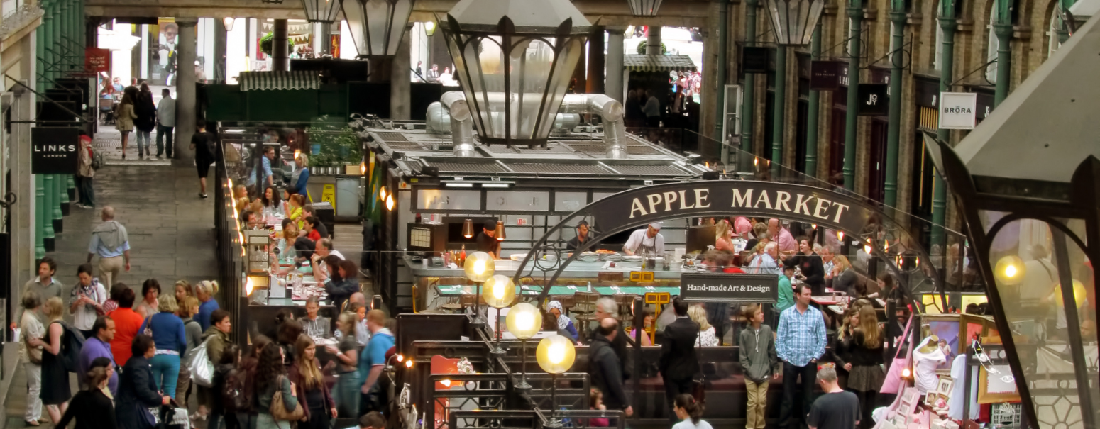 Aerial view of the inside of Covenet Garden in London with people.
